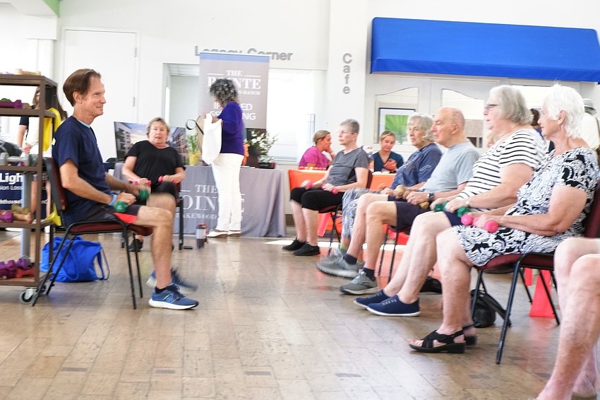 Mike McManus leads an aerobics class on July 28 during the Wellness in Motion Senior Health & Services Fair.