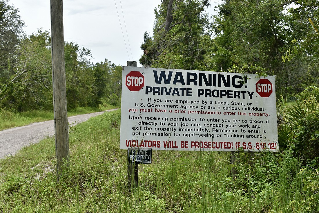 The No Trespass sign leading to William Pugh's residence on Hog Town Lane in Myakka City. Pugh has accrued $1.4 million in fines from Manatee County code enforcement violations.