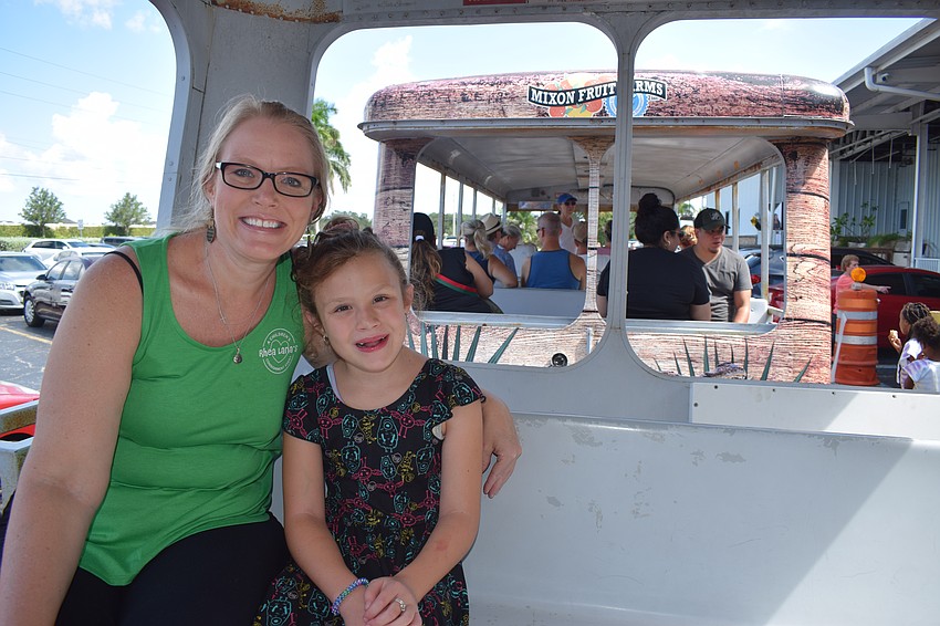 Anna Maria Island's Lori Zaworski takes her 8-year-old daughter Isabella Disalvo on a tram ride at Mixon Fruit Farms. Zaworski has been visiting the farm since she moved to the area in 2007.