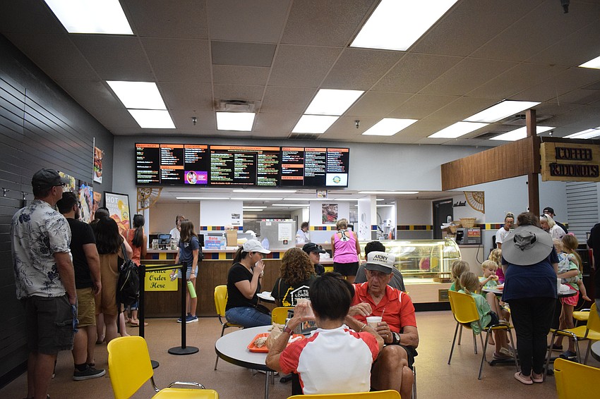 The cafe for the deli is packed on the last day Mixon Fruit Farms is open. The deli will reopen when Mixon Fruit Farms hosts an auction in September.