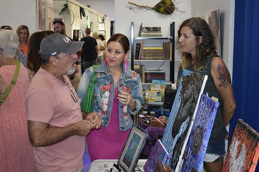 Chris and Terra Tominelli speak with artist Virginia Bright, who repurposes many used items for her paintings.