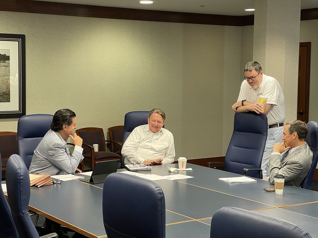 Jacksonville Bar Association Executive Director Craig Shoup, second for right, chats with city General Counsel Qualifications Review Committee members Jason Gabriel, John Delaney and Michael Orr after their public meeting July 31 at City Hall. The committee will select the city's next top attorney.