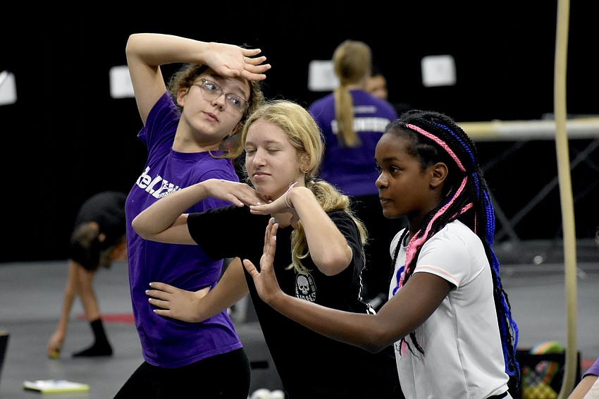 Molly Harris, 12, Rowen Heath, 14, and Isabella Francois, 10, strike a pose.