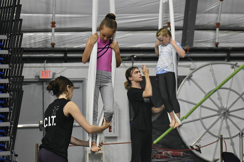 Elle Worthingm, 13, Juliet Bradley, 9, Ethan Kuykendall, 15 and Lyla Przylaba, 9, work with the hammocks.