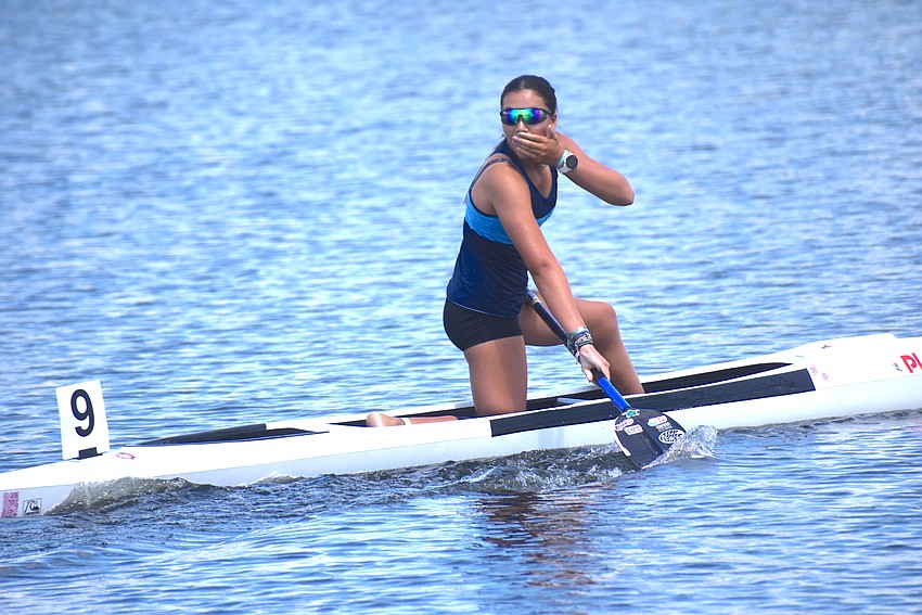 Malia Terry-Voisard finds out that she won the Women's Bantam C-1 200 meters on Friday at Nathan Benderson Park in the ACA Canoe Sprint National Championships.