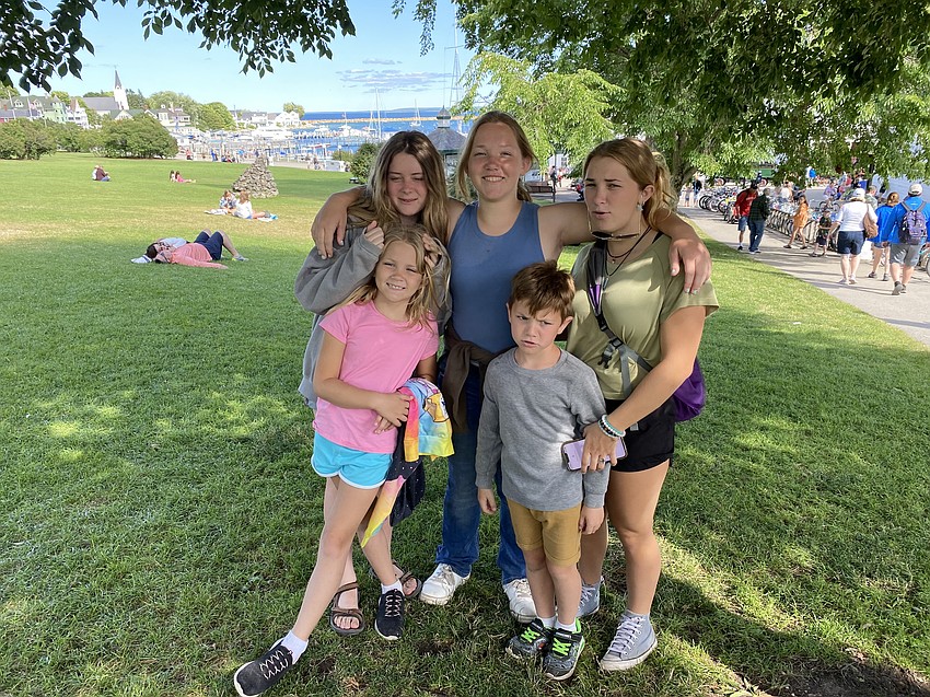 Liz Hawthorne, Avery Van Aken, a sophomore at Lakewood Ranch Preparatory Academy, and Dagny Van Aken (top row), Reagan Van Aken, a second grader, and Wesley Van Aken, a first grader, spend the day in Marquette Park in Mackinac Island, Michigan.