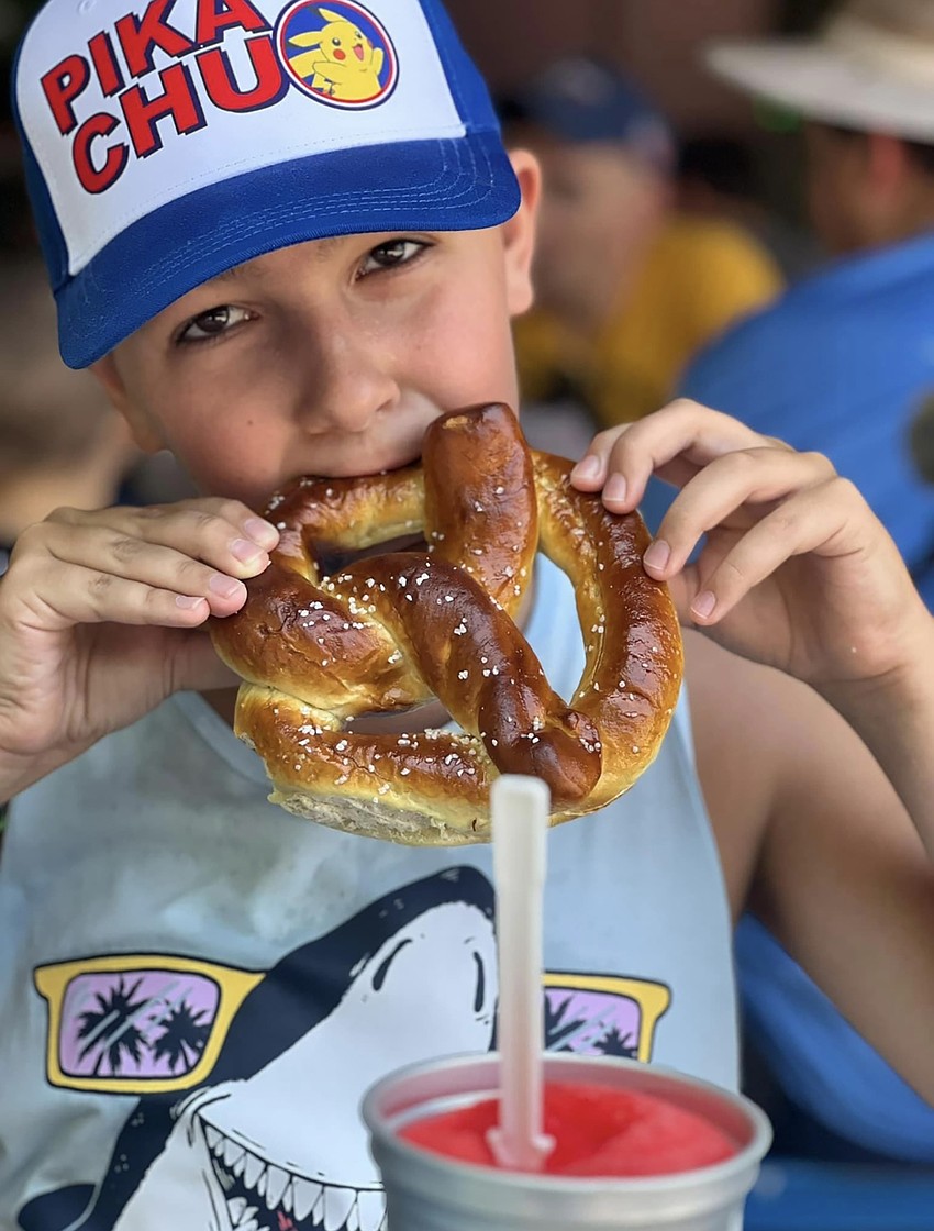 Levi Harell, a sixth grader at Lakewood Ranch Preparatory Academy, enjoys a snack during a visit to the North Carolina Zoo. He spent seven weeks in North Carolina with his grandparents.