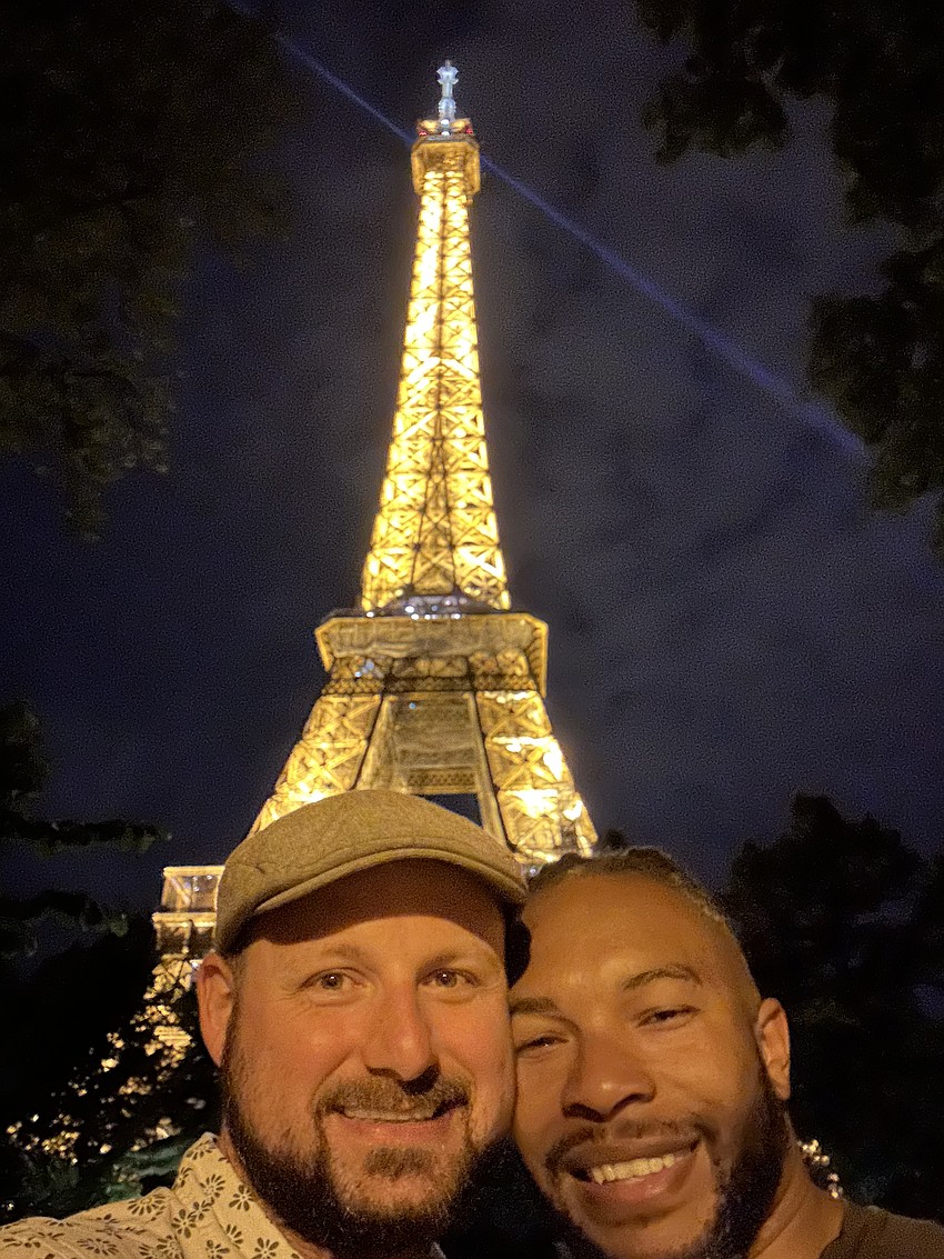 Matthew Robinson-Shinall and Ricardo Robinson-Shinall, who is a fine arts teacher at Braden River High, take in the beauty of the Eiffel Tower in Paris, France.