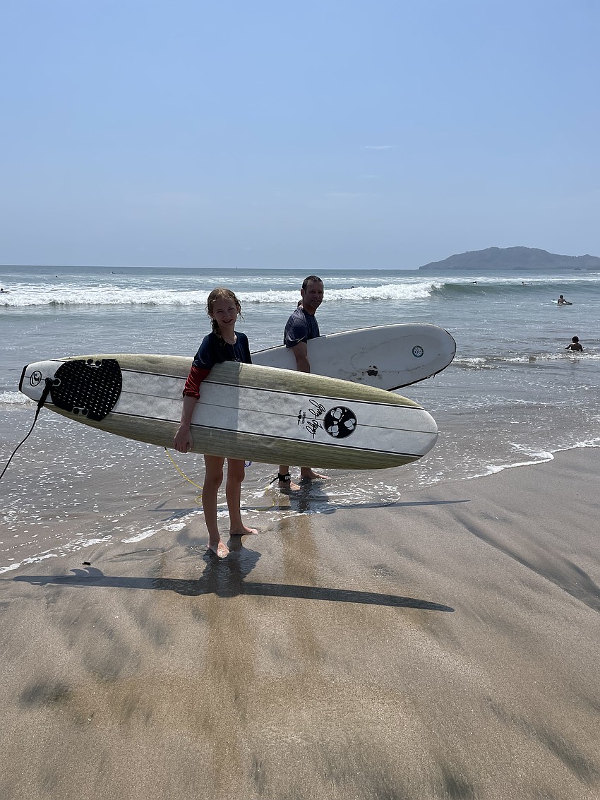 Taylor Niemann, a freshman at Lakewood Ranch Preparatory Academy, surfs with her dad, John Niemann, during a trip to Tamarindo, Costa Rica.