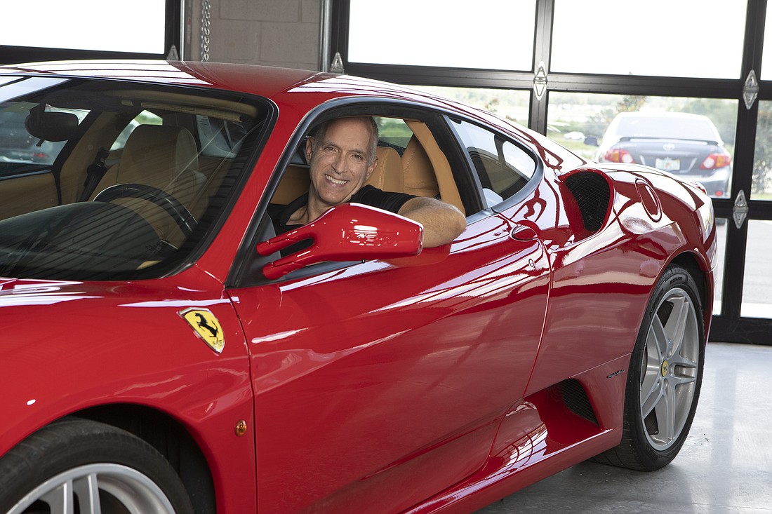 Paul Scarpello sits in a Ferrari at his Auburndale development, Circuit Florida, whose first condos and racetrack will open in the late fall.