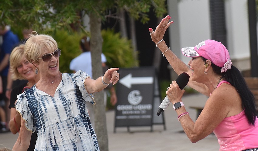 Lakewood Ranch's Sue Carlton had just had dinner at Good Liquid Brewing at Waterside Place Aug. 5 when she heard the music and decided to have some fun with singer Sheri Nadelman.