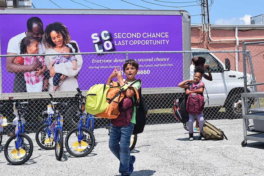 Anthony Schwartz excited to volunteer at the SCLO back-to-school drive with his summer camp friends.
