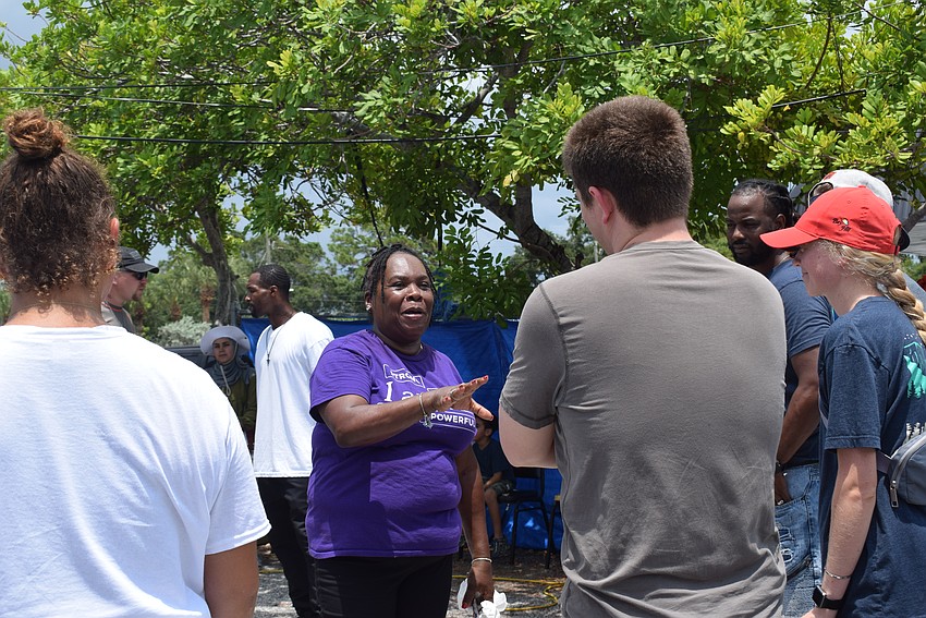 April Glasco talks to volunteers of the SCLO back-to-school drive
