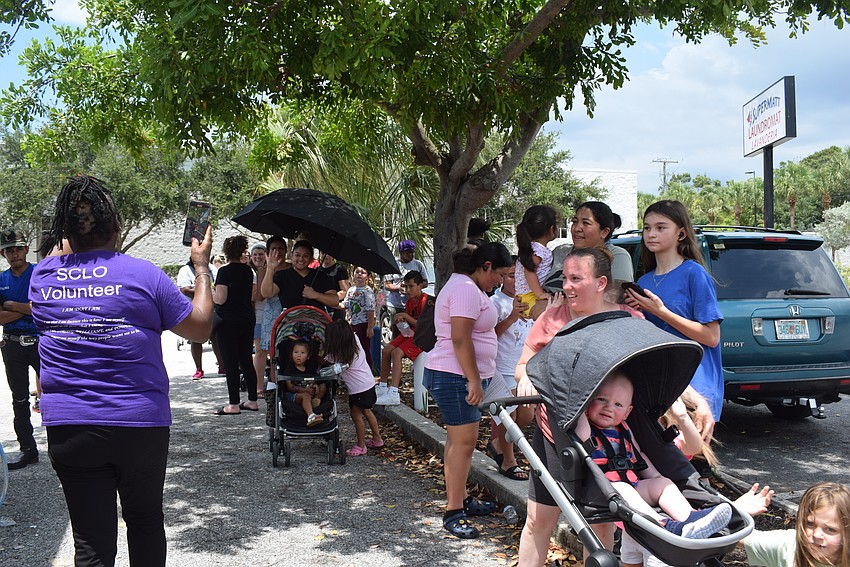 April Glasco greets everyone at the SCLO back-to-school drive.