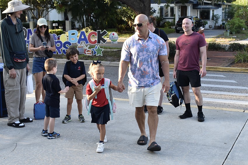 Leah Quattro, 5, heads to school with Matthew Quattro.