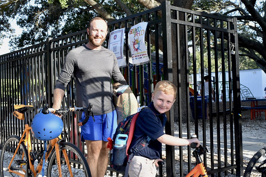 Brandon Ure and Desmond Ure, 5, arrive at school by bike.