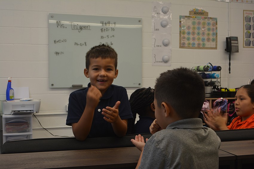 Second grader Zachary Choibekov plays with second grader Hendricks Perez