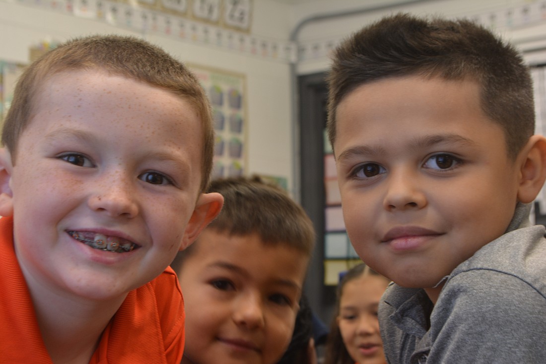 Second graders Wyatt Hill, Zachary Choibekov and Hendricks Perez