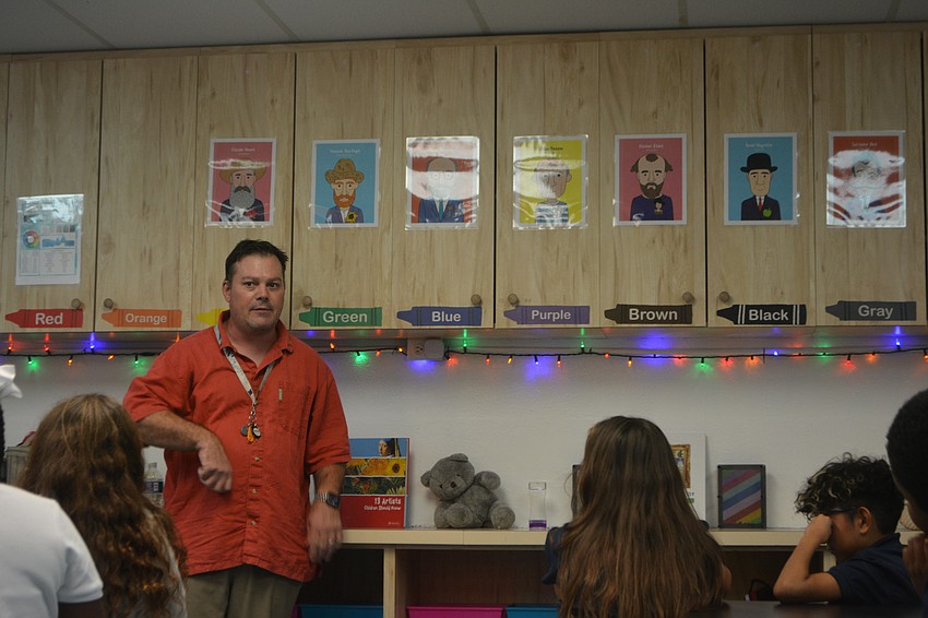Art teacher Mr. Tippett discusses tools and materials with fifth graders at Suncoast School for Innovative Studies.
