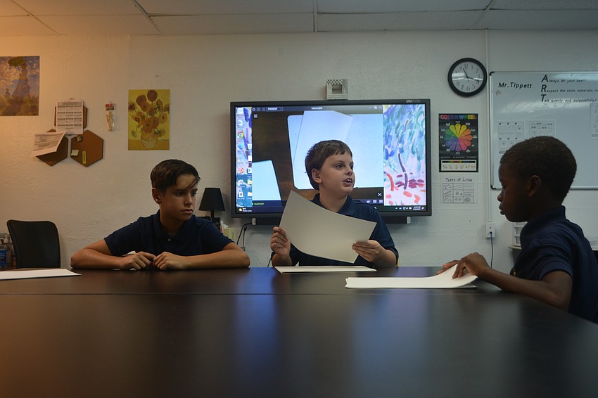 Leandro Rodriguez, Lucian Frazee and Trabeus Lemon work on their sketchbook projects in the fifth-grade art class at the Suncoast School for Innovative Studies.
