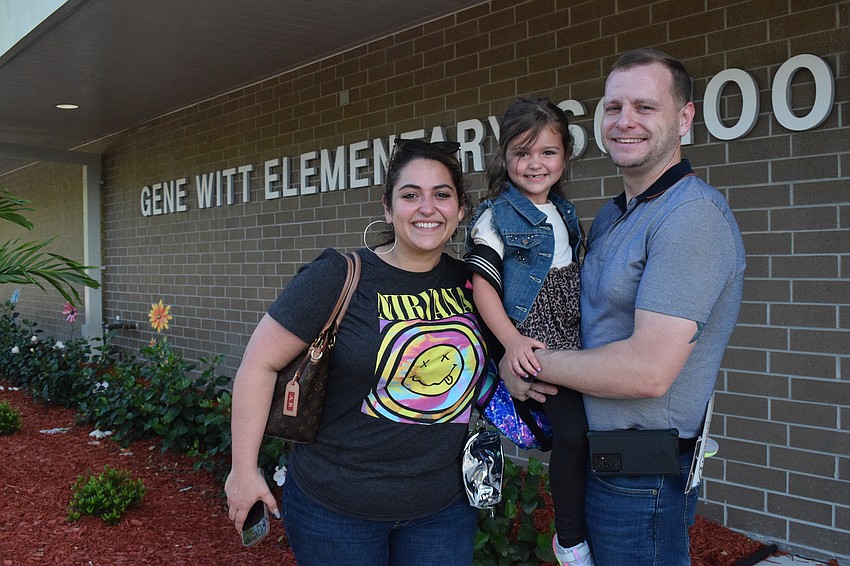 Alysha Robinson, Iliana Robinsons, who is in pre-K at Gene Witt Elementary School, and Josh Robinson get ready to drop Iliana Robinson off at her classroom. 