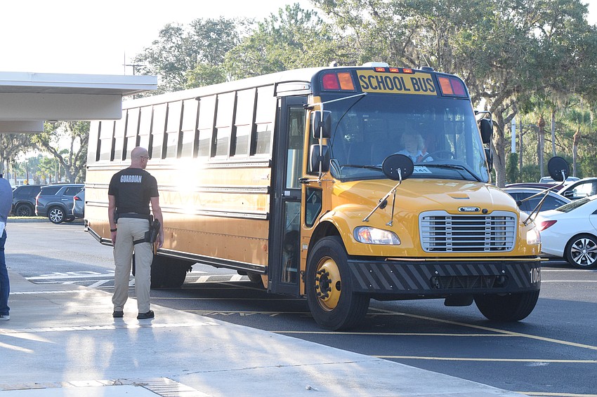 The first bus arrives at Gene Witt Elementary School.