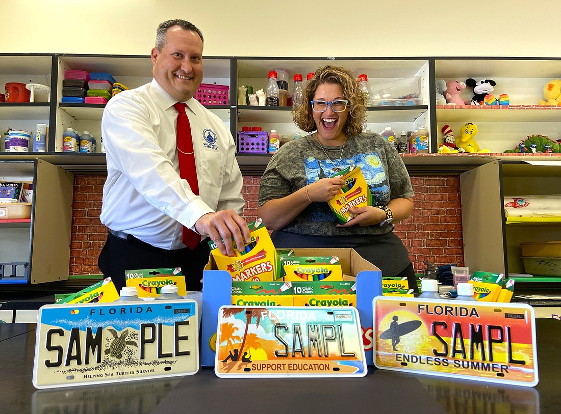 Volusia County Tax Collector Will Roberts and Sugar Mill Elementary School art teacher Faith Scrivano. Courtesy photo