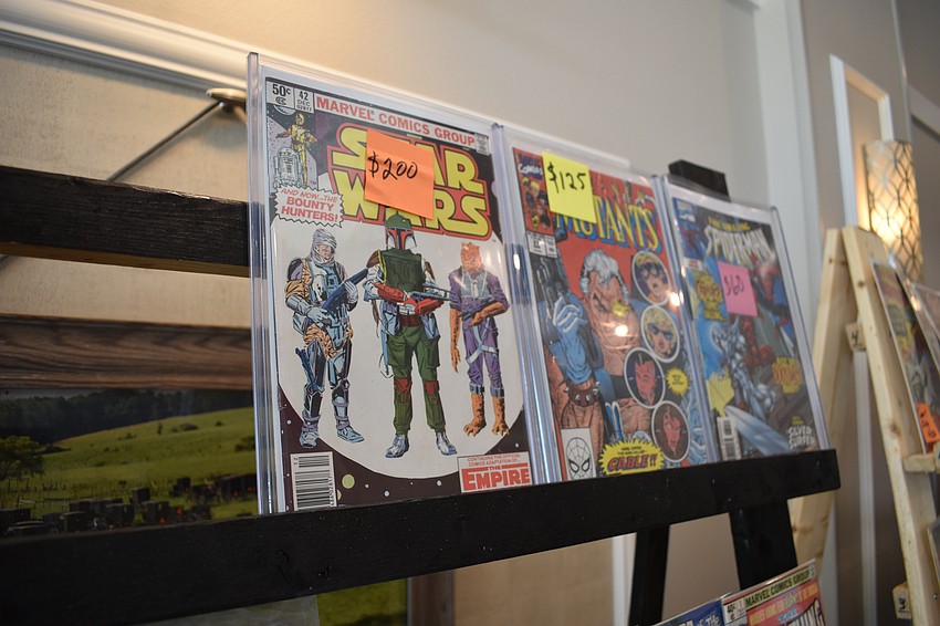Vintage comic books are set out for purchase.