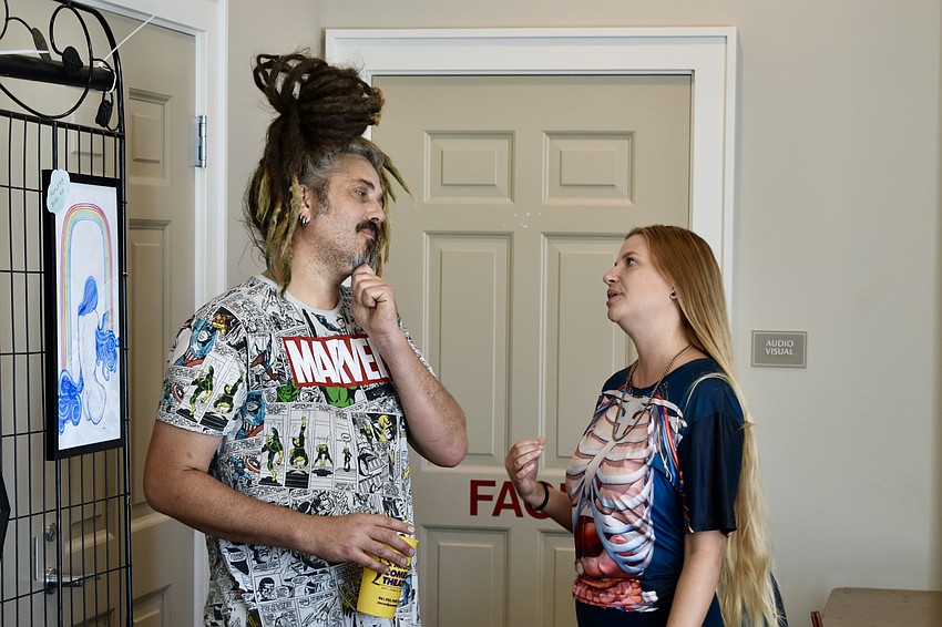 Sarasota vendors Erin Schwaner and Matthew Kelly chat with one another.