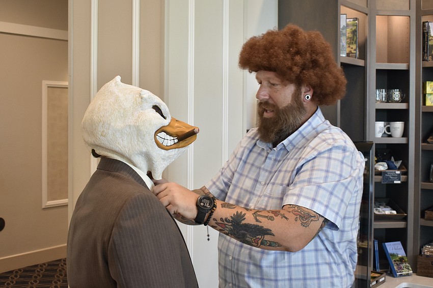 SarasotaCon is one of the few places where you can see Howard the Duck (Landon Huff) get his suit adjusted by Bob Ross (James Huff).