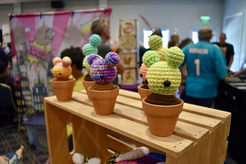 Crochet Items from the vendor Sugar Wyrm sit on display.