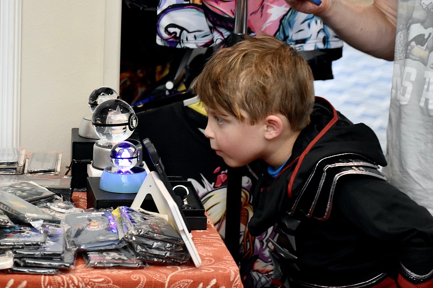 Tommy Trail, 6, looks inside a Pokémon bubblegram.