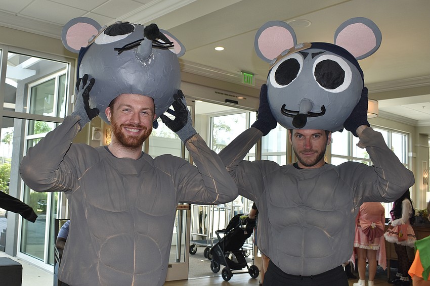 Kevin Whitlock and Tatum Britt dressed in self-made costumes as the Muscle Mice, characters who briefly feature in the anime Demon Slayer: Kimetsu no Yaiba.