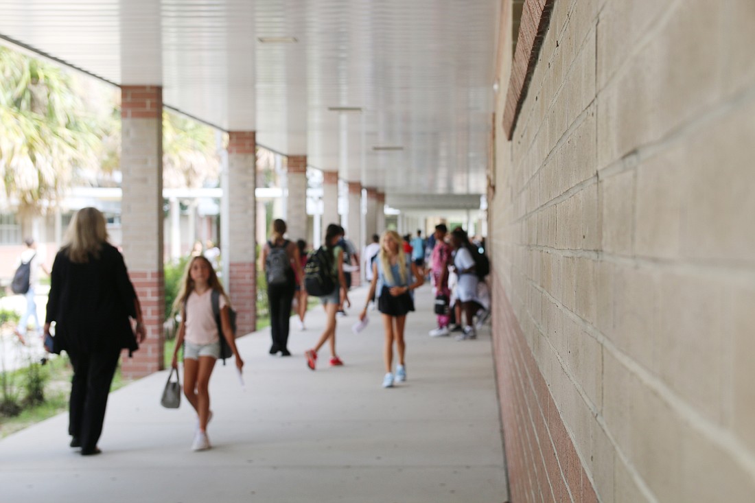 Students walk the halls at Hinson Middle School during the first day of school in 2023. Photo by Jarleene Almenas