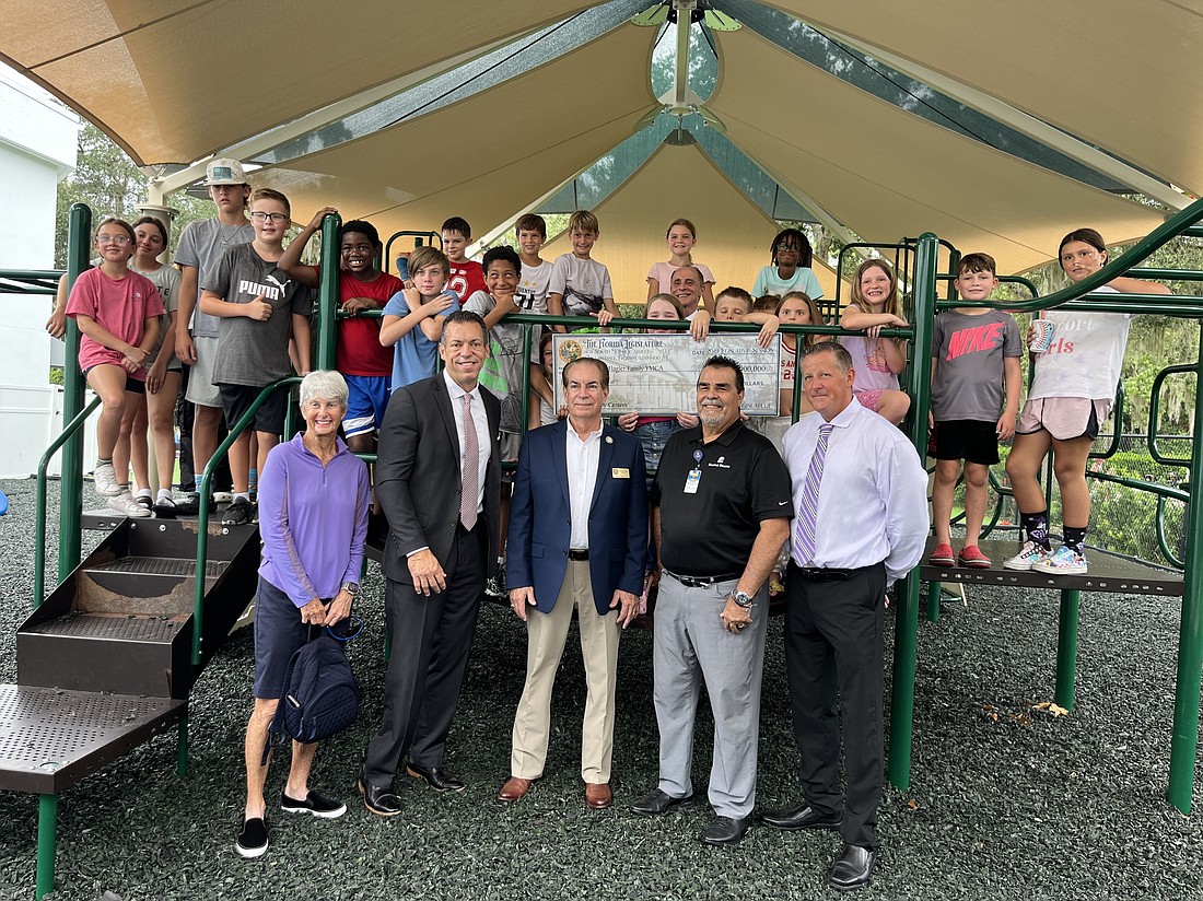 YMCA staff & volunteers on the Ormond Beach playground with Sen. Tom Wright. Photo courtesy of the Ormond Beach Family YMCA