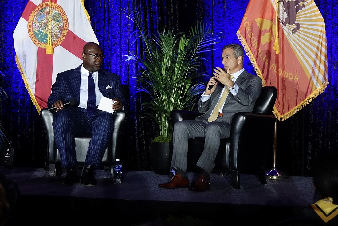 JAXUSA President Aundra Wallace, left, and Dun & Bradstreet CEO Anthony Jabbour take part in a Q&A session at JAXUSA Partnership’s quarterly luncheon Aug. 15.