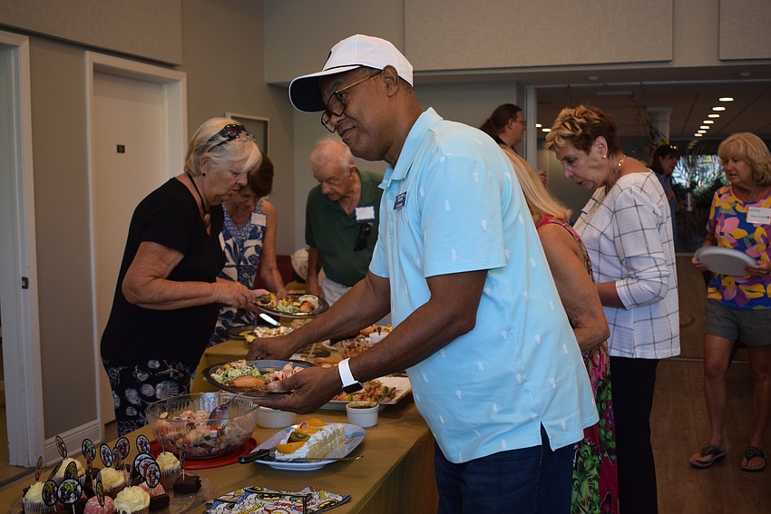 Longboat Island Chapel hosted their monthly charity happy hour collecting children's socks and shoelaces on Aug. 15.
