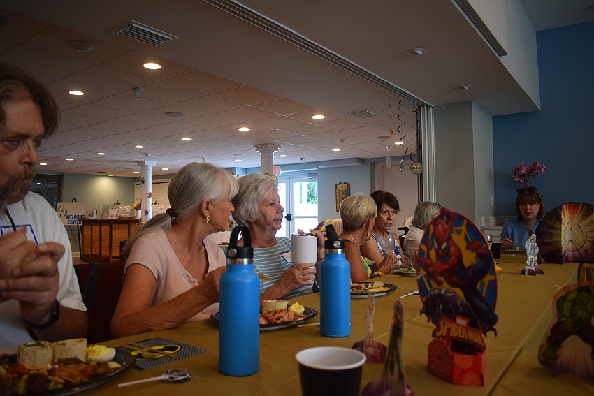 Longboat Island Chapel hosted their monthly charity happy hour collecting children's socks and shoelaces on Aug. 15.