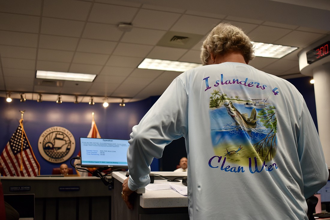 Holmes Beach City Commissioner Greg Kerchner was among the swarm of citizens speaking out against cuts to the comprehensive plan regarding wetlands.
