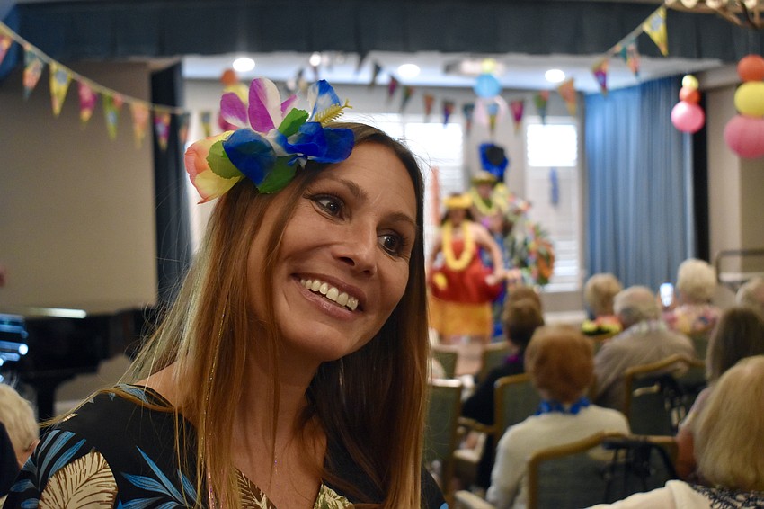 Director of Facets Jill Muzzy greets guests and gives each one a lei.