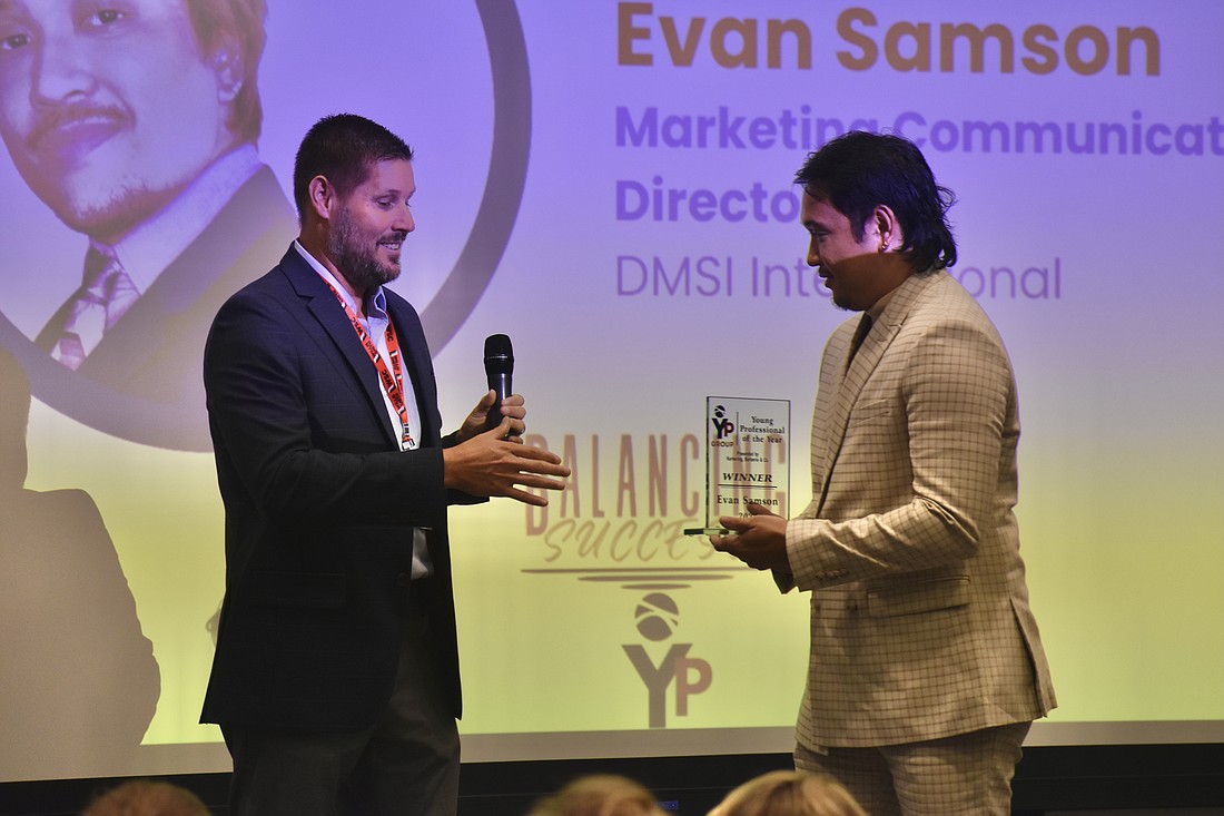 Eric Troyer of Kerkering, Barberio & Co. presents the award to Evan Samson.