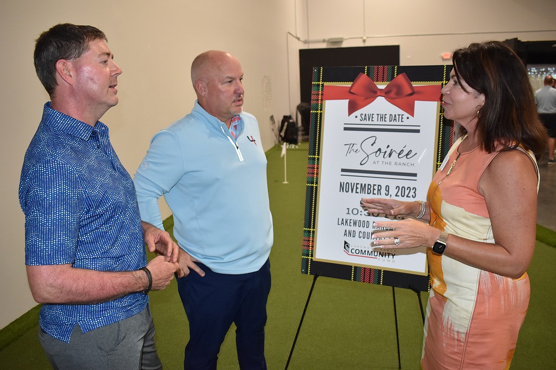 Short Par 4 owner Martin Haas and CFO Todd Stires talk to Lakewood Ranch Community Fund Board Member Debbie Urban about the non-profit's upcoming events.
