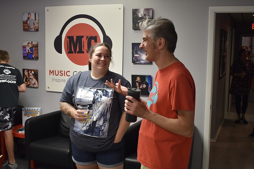 Brittany Emmons talks with Music Compound instructor Iain Harris.