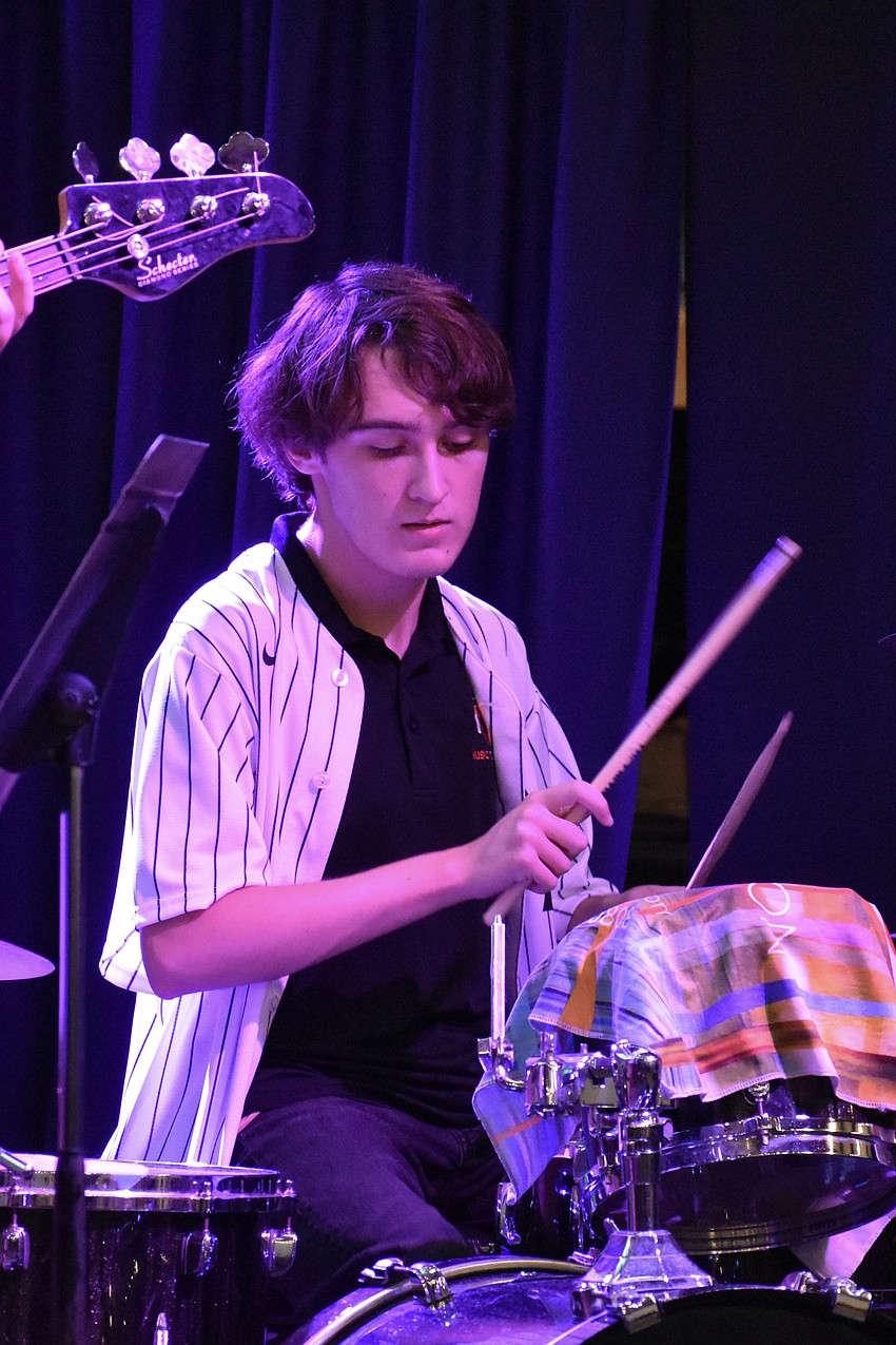 Braedon Rutkauski plays drums with Unspoken.