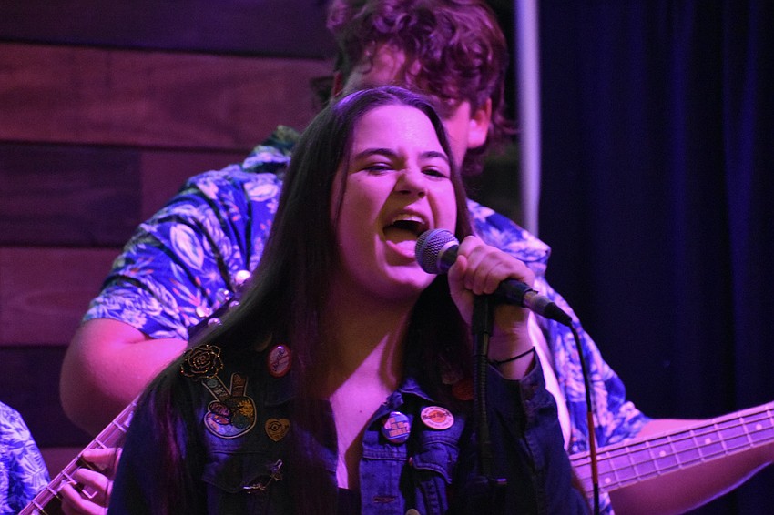 Rhys Kallins of the student band Unspoken finishes a song on a high note.