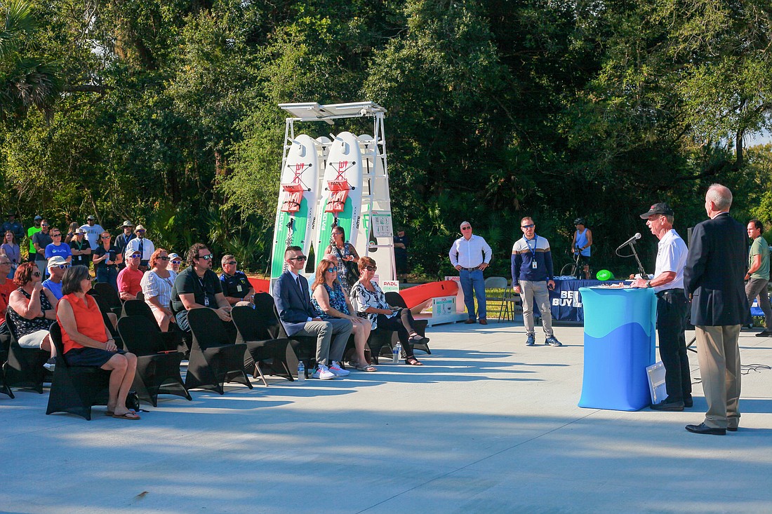 Florida Inland Navigation District Commissioner Randy Stapleford speaks at an Aug. 18 ribbon-cutting ceremony for renovations at Waterfront Park. Palm Coast Mayor David Alfin is at right. Photo by Dori Umansky