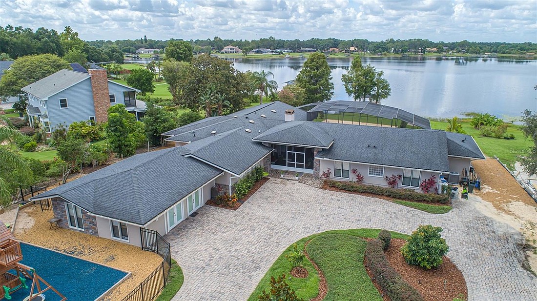 The home at 1410 Crescent Lake Drive, Windermere, sold Aug. 8, for $1,865,000. This lakefront home sits on 4.64 acres. The selling agent was Vinnie Warren, Keller Williams at the Lakes.