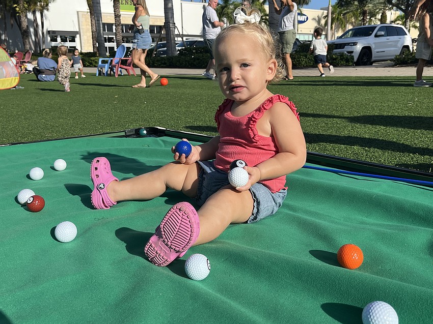 Nokomis 15-month-old Lilly Murphy has a unique approach to mini golfing. Her mother, Heather Murphy, says UTC Kids Club is a new way for them to find a different playgroup.
