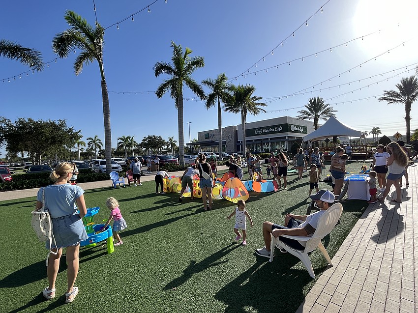 Dozens of children make their way with their parents to the Green at UTC for UTC Kids Club. From bubbles to blocks to baseball and water activities, there was something for everyone.