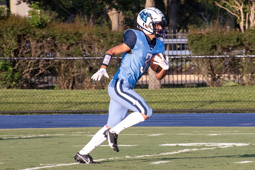 ODA senior John Moschella returns the game's opening kickoff.